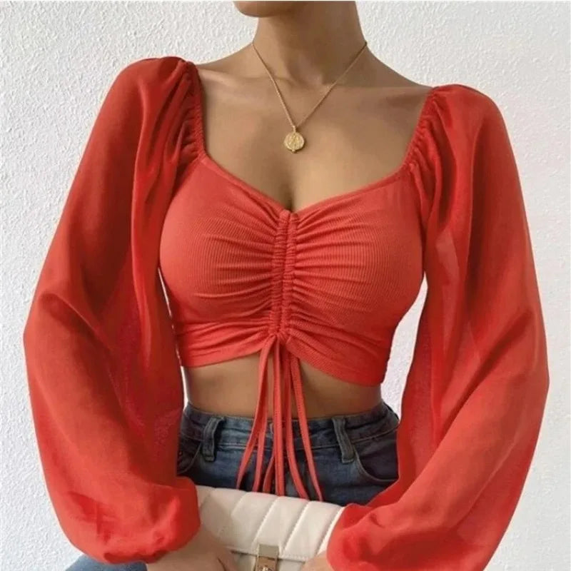 Blusa Sexy de malla con mangas acampanadas y cordón para mujer, blusa con ombligo descubierto en el pecho.