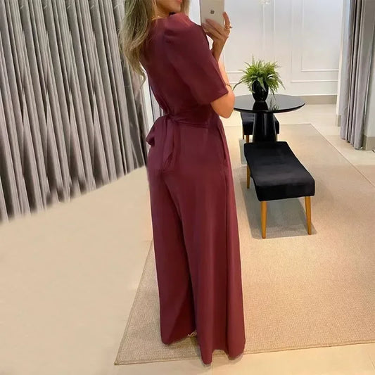 Mono elegante con cuello en V y pantalón palazzo